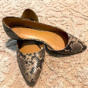 A new day flats with cut outs new condition size 7 1/2 snake skin versatile